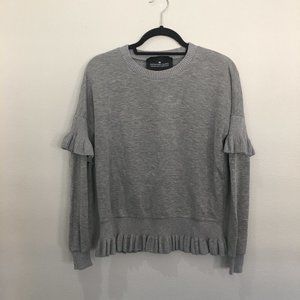 Designer Remix gray crew neck sweater with ruffles at hem and mid arm
